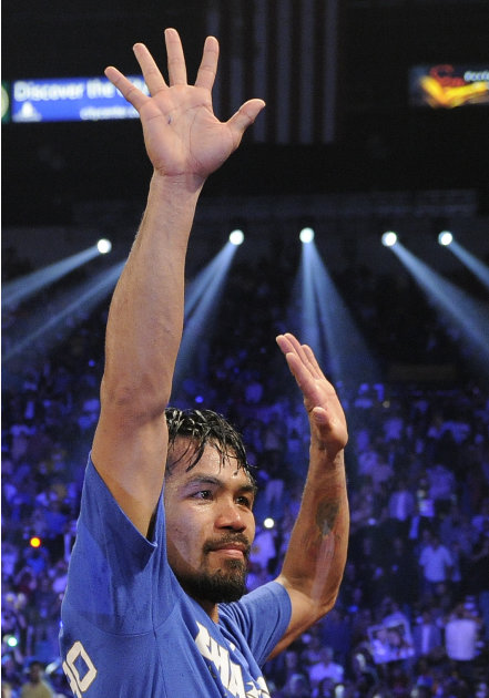 Manny Pacquiao reacts after defeating Shane Mosley by unanimous decision during a WBO welterweight title bout, Saturday, May 7, 2011, in Las Vegas.  (AP Photo/Mark Terrill)