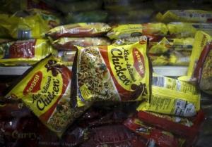 Packets of Nestle&#39;s Maggi instant noodles are seen on display at a grocery store in  Mumbai