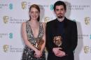 US actress Emma Stone (L) poses with the award for a Leading Actress and US director Damien Chazelle poses with the award for a Director for work on the film "La La Land" at the BAFTA British Academy Film Awards in London on February 12, 2017