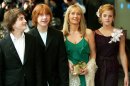FILE - This Sunday May 30, 2004 file photo shows Daniel Radcliffe, left, who plays Harry Potter, Rupert Grint, second left, who plays Ron Weasley, and Emma Watson, right, who plays Hermione Granger, at the UK premiere of 
