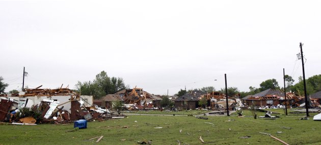 A series of heavily damaged homes are pictured after a tornado struck a residential neighborhood in Lancaster