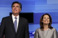 Republican presidential candidates former Massachusetts Gov. Mitt Romney and Rep. Michele Bachmann, R-Minn. pose for a photo before the start of the Iowa GOP/Fox News Debate at the CY Stephens Auditorium in Ames, Iowa, Thursday, Aug. 11, 2011. (AP Photo/Charlie Neibergall)