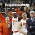 Syracuse head coach Jim Boeheim, right, stands with his team as they start to celebrate as they lead with time running down  in the second half of an East Regional NCAA tournament third-round college basketball game against Kansas State in the NCAA college basketball game on Saturday, March 17, 2012 in Pittsburgh. Syracuse won 75-59. (AP Photo/Keith Srakocic)