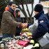 In this photo provided by Sportstars, football player Oday Aboushi, left, helps distribute presents to people affected by Superstorm Sandy in the Staten Island borough of New York, Saturday, Dec. 22, 2012. Aboushi, an NCAA college football offensive lineman from Virginia and potential first-round pick in the NFL draft, returned to a neighborhood he once hung out in while growing up in New York to lend a hand to nearly 1,000 residents in need of food, clothing and supplies. (AP Photo/Sportstars, Emil Boccio)