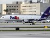 In this Thursday, Oct. 11, 2012 photo, a FedEx cargo jet taxis on the runway after landing at Miami International Airport in Miami. FedEx says its third-quarter profit fell 31 percent as customers are opting for less-expensive ground shipping, hurting the company's airfreight business. (AP Photo/Wilfredo Lee)