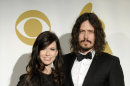 FILE - In this Nov. 30, 2011 file photo, Joy Williams, left, and John Paul White of the band The Civil Wars pose backstage at the Grammy Nominations Concert in Los Angeles. A news release Friday morning March 16, 2012 says the delay in shows from March 26 through April 4 is due to a serious illness in the band's immediate family, but doesn't give further details. (AP Photo/Chris Pizzello, file)