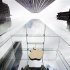 The Apple logo hangs in a glass enclosure above the 5th Ave Apple Store in New York