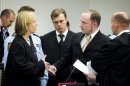 Accused Norwegian Anders Behring Breivik, second right, talks to public prosecutor Inga Bejer Engh at the courtroom, in Oslo, Norway, Tuesday April 17, 2012. The anti-Muslim fanatic who admitted to killing 77 people in a bomb-and-shooting massacre is set to take the stand in his terror trial. Anders Behring Breivik will have five days to explain why he set off a bomb in Oslo's government district, killing eight, and then gunned down 69 at a Labor Party youth camp outside the Norwegian capital. (AP Photo/Heiko Junge/Scanpix Norway/POOL)