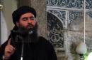 This July 5, 2014 video grab taken from a propaganda video by al-Furqan Media allegedly shows the leader of the Islamic State jihadist group, Abu Bakr al-Baghdadi, adressing Muslim worshippers at a mosque in Mosul, Iraq