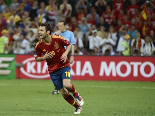 Spanish midfielder Cesc Fabregas celebrates after scoring the winning penalty
