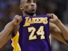 Los Angeles Lakers' Kobe Bryant adjusts his jersey during the first half of an NBA basketball game against the Phoenix Suns, Sunday, Feb. 19, 2012, in Phoenix. (AP Photo/Matt York)
