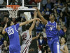 Kentucky's Anthony Davis (23) and Kentucky's Terrence Jones (3) block a shot by South Carolina's Damien Leonard (32) during the first half of their NCAA college basketball game on Saturday, Feb. 4, 2012, in Columbia, S.C. (AP Photo/Mary Ann Chastain)