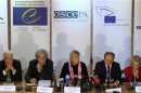 Members of the Parliamentary Assembly of the Organisation for Security and Cooperation in Europe (OSCE) attend a news conference in Kiev