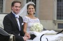 FILE - This is a Saturday June 8, 2013 file photo of Princess Madeleine of Sweden and Christopher O'Neill leave in an open carriage after their wedding ceremony at the royal chapel in Stockholm. Sweden's Royal Palace said Tuesday Sept. 3, 2013 that Princess Madeleine and her husband, New York banker Christopher O'Neill, are expecting their first child in March. (AP Photo/Soren Andersson) SWEDEN OUT