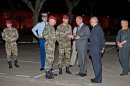 In this photo of Thursday March 15, 2012, French defense minister Gerard Longuet, center, speaks with soldiers at the site of the shooting of three French soldiers in Mautauban, southern France. A gunman on a motorbike opened fire on three uniformed paratroopers at a bank machine Thursday in Montauban in southern France, killing two and critically wounding the other. The incident occurred not far from their barracks. French police have broadened a probe into the shooting deaths of two paratroopers to include counterterrorism investigators and specialists in serial killers, officials said Friday. (AP Photo/Frederic Lancelot)