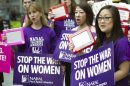 Members of the National Abortion Rights Action League protest with their 