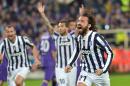 Juventus' Andrea Pirlo celebrates after scoring during an Europa League, round of 16, return-leg soccer match between Fiorentina and Juventus, at the Artemio Franchi stadium in Florence, Italy, Thursday, March 20,, 2014. (AP Photo/Massimo Pinca)