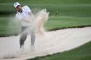 England's Oliver Wilson hits a bunker shot during the first round of the Hong Kong UBS Open on December 1, 2011