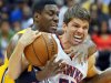 Atlanta Hawks' Kyle Korver and Indiana Pacers' Ian Mahinmi scramble for the ball during the second half of Game 6 of an NBA basketball first-round playoff series Friday, May 3, 2013, in Atlanta. The Pacers won 81-73 and took the series. (AP Photo/Atlanta Journal Constitution, Curtis Compton) GWINNETT OUT  MARIETTA OUT