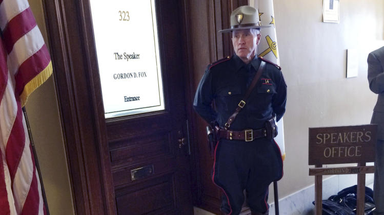 A Rhode Island state trooper stands outside the office of House Speaker Gordon Fox Friday, March 21, 2014 at the Statehouse in Providence, R.I. A U.S. attorney&#39;s office spokesman said his office, the FBI, IRS and state police are engaged in a law enforcement action, but would not comment whether the Democratic House speaker was being investigated. (AP Photo/Erika Niedowski)
