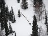 A musher competing in the Iditarod Trail Sled Dog Race heads toward the Finger Lake, Alaska, checkpoint on Monday, March 5, 2012. (AP Photo/Anchorage Daily News, Marc Lester)