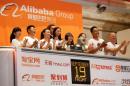 Alibaba employees applaud as the opening bell of the New York Stock Exchange is rung, before the initial public offering (IPO) of Alibaba Group Holding Ltd under the ticker "BABA" in New York