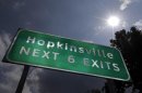 This Aug. 27, 2012 photo shows a road sign under the afternoon sun outside Hopkinsville, Ky. When the next total eclipse of the sun darkens skies over parts of the United States on Aug. 21, 2017, the afternoon event will last longer in a rural stretch near Hopkinsville than any place on the planet. (AP Photo/Mark Humphrey)