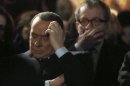 Former Italian Premier Silvio Berlusconi, foreground, sits in front of Norther League party's leader Roberto Maroni in Milan, Italy, Sunday, Jan. 27, 2013. Silvio Berlusconi says Benito Mussolini did much good, except for dictator's regime's anti-Jewish laws. Berlusconi also defended Mussolini for siding with Hitler, saying the late fascist leader likely reasoned that German power would expand so it would be better for Italy to ally itself with Germany. He was speaking to reporters Sunday on the sidelines of a ceremony in Milan to commemorate the Holocaust. When Germany's Nazi regime occupied Italy during World War II, thousands from the tiny Italian Jewish community were deported to death camps. In 1938, before the war's outbreak, Mussolini's regime passed anti-Jewish laws, barring them from universities and many professions, among other bans. Berlusconi called the laws Mussolini's "worst fault" but insisted that in many other things, "he did good." (AP Photo/Antonio Calanni)