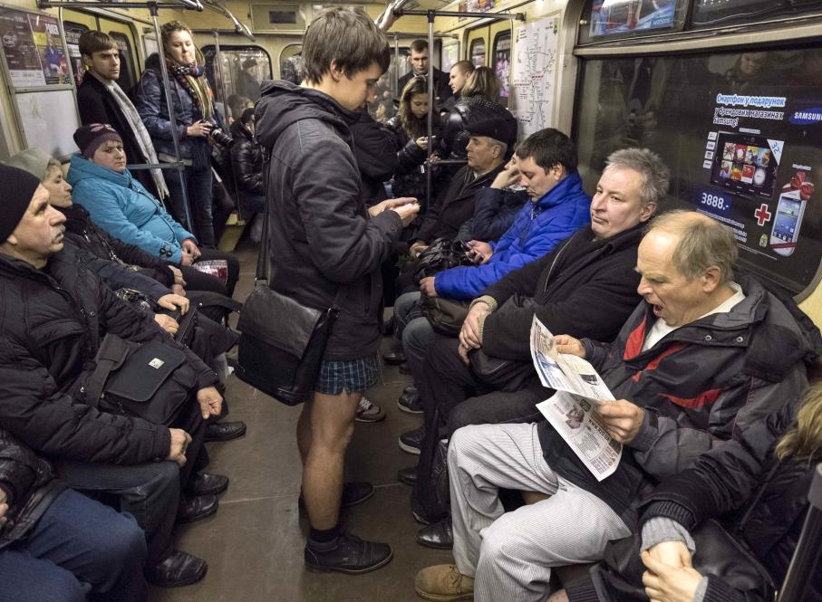 A passenger without pants rides a subway train during the "No Pants Subway Ride" in Kiev