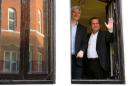 Ecuadurian Foreign Minister Ricardo Patino (R) and Wikileaks founder Julian Assange appear at the window of the Ecuadorian embassy in central London on June 16, 2013