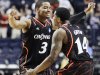 Cincinnati's Dion Dixon (3) and Ge'Lawn Guyn (14) celebrate after defeating Florida State 62-56 in the second half of a third-round NCAA college basketball tournament game on Sunday, March 18, 2012, in Nashville, Tenn. (AP Photo/Mark Humphrey)