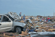 The tornado that ripped through Moore, Okla., on May 20, 2013, flattened homes and piled cars on top of one another.