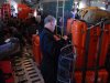 In this image provided by the U.S. Coast Guard, Air National Guard parajumpers, from the 129th Rescue Wing prepare medical supplies to be dropped from a Coast Guard aircraft to a 67-foot sailing yacht with three injured persons aboard, the Clipper Venture Six which is sponsored by Geraldton Western Australia, in the Round the World Yacht Race, Saturday, March 31, 2012. The Coast Guard's Rescue Coordination Center in Alameda, Calif. is coordinating the efforts to rescue the three injured persons 400 miles west of San Francisco.  (AP Photo/Seaman David Flores, U.S. Coast Guard)