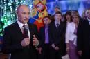 Russia's President Vladimir Putin delivers his New Year's address to the nation in Khabarovsk on December 31, 2013