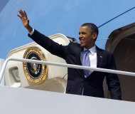 President Barack Obama waves as he boards Air Force One before his departure from Andrews Air Force Base, Md., Monday, July, 30, 2012. Obama is traveling to New York for a private fundraiser. (AP Photo/Pablo Martinez Monsivais)