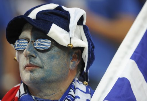 A Greek fan attends their Group A Euro 2012 soccer match against Poland in Warsaw