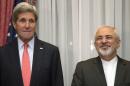 U.S. Secretary of State Kerry and Iran's Foreign Minister Zarif pose for a photograph before resuming talks over Iran's nuclear programme in Lausanne