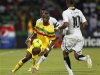 Mali's Samba Diakite challenges Ghana's Dede Ayew during their African Nations Cup Group D soccer match in Franceville Stadium