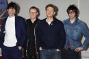 From left, Alex James, Dave Rowntree, Damon Albarn, Graham Coxon, of Blur arrive for the Brit Awards 2012 at the O2 Arena in London, Tuesday, Feb. 21, 2012. (AP Photo/Jonathan Short)
