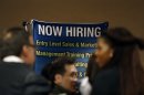 Job seekers stand in line to meet prospective employers at a career fair in New York City
