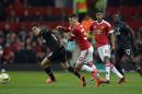 Liverpool's midfielder Philippe Coutinho (L) vies with Manchester United's defender Guillermo Varela during the UEFA Europa League round of 16, second leg football match in Manchester, England on March 17, 2016