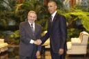 Cuban President Raul Castro, left, shakes hands with U.S. President Barack Obama during a meeting in Revolution Palace, Monday, March 21, 2016. Brushing past profound differences, President Obama and President Castro sat down for a historic meeting, offering critical clues about whether Obama's sharp U-turn in policy will be fully reciprocated. (AP Photo/Ramon Espinosa)