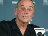 FILE - In this Nov. 1, 2006, file photo, then-Michigan State coach John L. Smith speaks to reporters at an NCAA college football news conference, in East Lansing, Mich. A person familiar with the decision says Arkansas is bringing back John L. Smith on an interim basis next year to replace Bobby Petrino. Petrino was fired April 10 after his affair with a woman he hired as his assistant was revealed by an April 1 motorcycle crash. (AP Photo/Al Goldis, File)