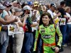 Danica Patrick smiles as she walks past fans during driver introductions before the NASCAR Sprint Cup Series auto race, Sunday, March 3, 2013, in Avondale, Ariz. (AP Photo/Ross D. Franklin)