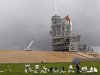 The space shuttle Atlantis sits on the launch pad as a rain cloud passes at the Kennedy Space Center Thursday, July 7, 2011, in Cape Canaveral, Fla. Atlantis is scheduled to launch on Friday, July 8 and is the 135th and final space shuttle launch for NASA. (AP Photo/Terry Renna)