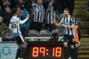 Newcastle United's defender Paul Dummett (R) celebrates with striker Ivan Toney (L) after scoring his side's third goal during the match against Manchester United in Newcastle-upon-Tyne on January 12, 2016