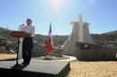 In this photo released by Chile's Presidency, Chile's President Sebastian Pinera delivers a speech during an event marking the second anniversary of the cave-in at the San Jose mine in the Atacama, honoring the miners who survived in entrapment longer than anyone else before, in front of a monument on the outskirts of Copiapo, Chile, Sunday, Aug. 5, 2012. Pinera traveled to the northern city of Copiapo to join the men at the mouth of the mine that nearly became their rocky grave. They unveiled a five-meter (16 1/2-foot) cross as part of a monument known as the "The 33 miners of Atacama: The miracle of life." (AP Photo/Chile's Presidency)