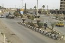 Syrian army tanks are seen in Deir al-Zour city