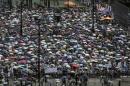 Thousands of pro-democracy protesters gather to march in the streets to demand universal suffrage in Hong Kong