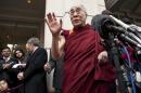 The Dalai Lama speaks to the media after meeting with U.S. President Obama and Clinton, U.S. Secretary of State, outside his hotel in Washington
